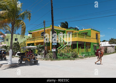 sandy road with tourists and stalls on holbox island, quintana roo, mexico located in north yucatan peninsula. Stock Photo