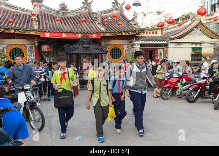HO CHI MINH, VIETNAM, FEBRUARY 24 , 2015: Vietnamese students in Chinese language are leaving school at the Ong Bon Pagoda, in Chinatown, district 5 o Stock Photo
