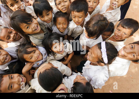 SIEM REAP, CAMBODIA, DECEMBER 04, 2012: group of joyful kids posing in a schoolyard in Siem Reap, Cambodia Stock Photo