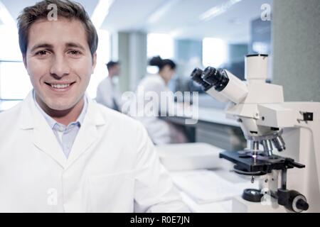 Portrait of male laboratory assistant smiling. Stock Photo