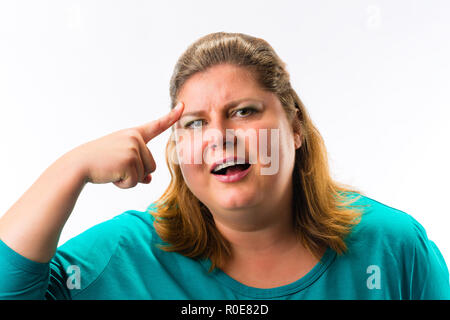 Woman touching her forehead with finger Stock Photo