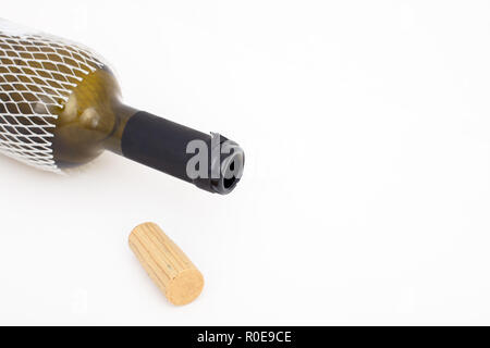 Empty red wine bottle  and cork  isolated on white background with copy space , high angle view Stock Photo