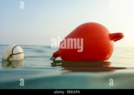 Closeup of sea buoy, photo from ocean surface level. Stock Photo