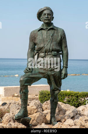 The Statue of General George Grivas-Dhigenis leader of the liberation struggle of EOKA 1955-59 on the shoreline in Chlorakas, Paphos Cyprus. Stock Photo