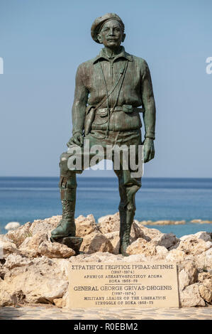 The Statue of General George Grivas-Dhigenis leader of the liberation struggle of EOKA 1955-59 on the shoreline in Chlorakas, Paphos Cyprus. Stock Photo