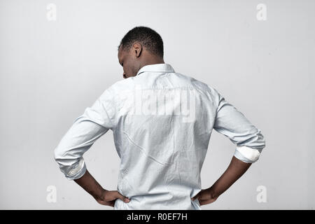 African man in white shirt turning back Stock Photo