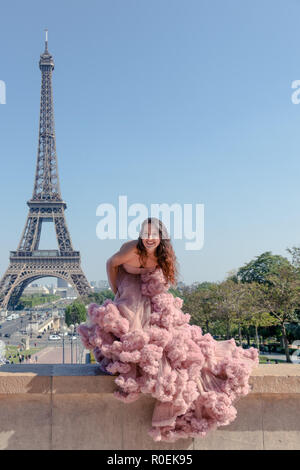 hipster dress to impress Beautiful girl dressed in a pastel pink ballroom with Eiffel Tower in background Stock Photo What Is Indie Style? Here