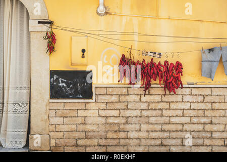 Peperoni cruschi, sun dried red chili peppers in Spinazzola, Puglia Stock Photo