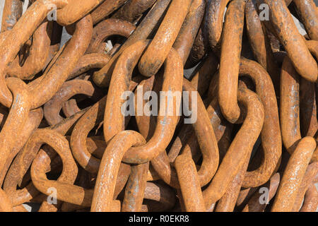 A pile of rusty anchor chain on the quayside at Kilkeel, County Down, Northern Ireland. Stock Photo
