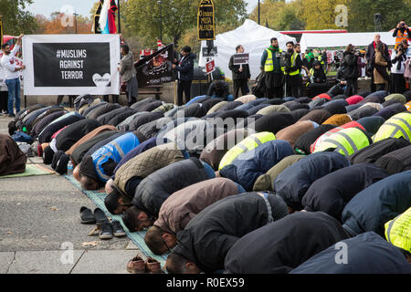 London, UK. 4th November, 2018. Shia Muslims pray before the 38th Arbaeen procession. It is held every year to coincide with a pilgrimage to Karbala in Iraq, the largest annual gathering of people anywhere on earth, which honours the martyrdom of Imam Hussein ibn Ali, the grandson of the Holy Prophet Muhammed, who was killed in the battle for Karbala in AD680. Credit: Mark Kerrison/Alamy Live News Stock Photo