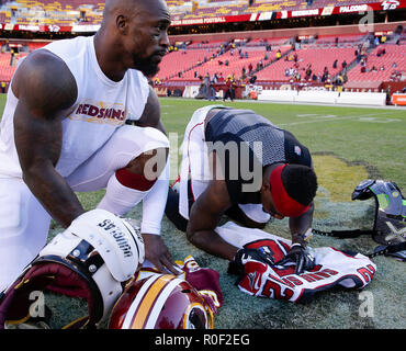 East Rutherford, New Jersey, USA. 9th Sep, 2018. New York Giants running  back Saquon Barkley (26) and Jacksonville Jaguars defensive tackle Calais  Campbell (93) swap jerseys after a NFL game between the