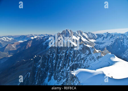 The Aiguille du Midi is a mountain in the Mont Blanc massif within the French Alps, accessed by cable car from Chamonix. Stock Photo