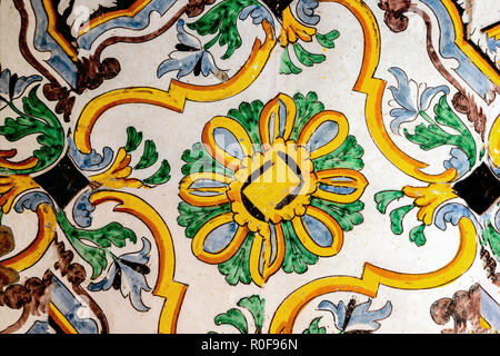 Ancient ceramic floor tiles with floral patterns in Polo Museale A Cordici, Erice, Sicily, Italy. Stock Photo
