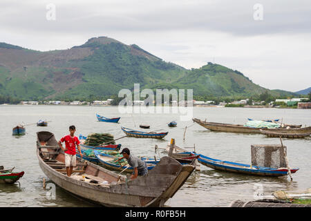 fishermen preparing traditional wooden boat for fishing trip in Hue, Vietnam Stock Photo