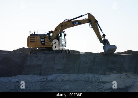 RYNARZEWO, KUJAWSKO-POMORSKIE/POLAND - OCTOBER 10, 2018 - Caterpillar excavator working on top of an earthwork, preparing place for S5 freeway constru Stock Photo