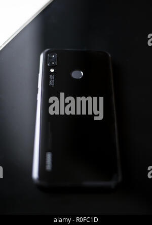 Shiny new P20 Lite mobile cell phone made by Chinese technology brand Huawei with dual lens camera and fingerprint recognition technology Stock Photo