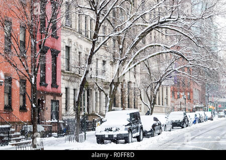 Winter scene with snow covered cars parked along Stuyvesant Street in the East Village of Manhattan New York City Stock Photo