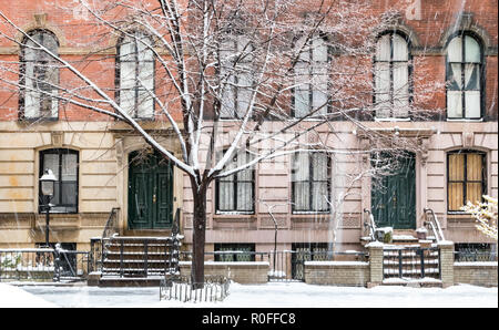 Winter scene with snow covered sidewalks along Stuyvesant Street in the East Village neighborhood of New York City Stock Photo
