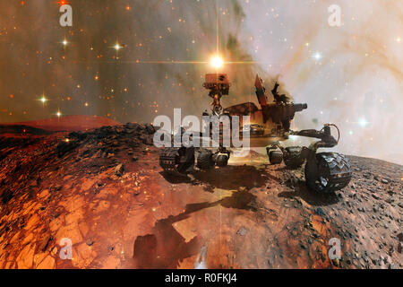 Curiosity Mars Rover exploring the surface of red planet. Elements of this image furnished by NASA. Stock Photo