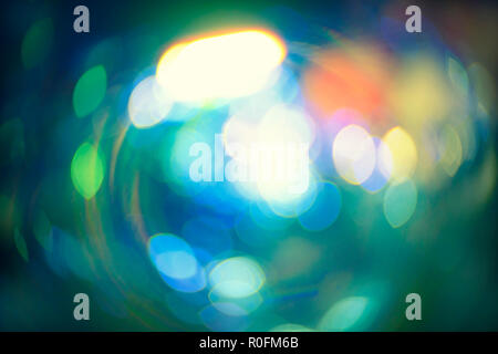 Defocused Christmas Lights, shiny bokeh for winter holiday design, many blurry elements on dark Stock Photo