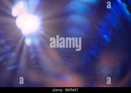Vintage purple and blue bokeh lights beams shine on dark background with copy-space, defocused lights purple soft shade with flare, wallpaper for Xmas Stock Photo