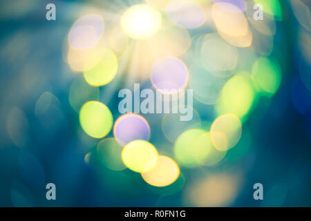 Colorful bokeh background. Abstract blurred circles bokeh lights in green and yellow. Stock Photo