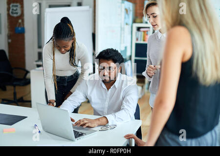 computer programmer is fixing the laptop at workplace Stock Photo