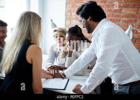 supportive young people holding hands together Stock Photo
