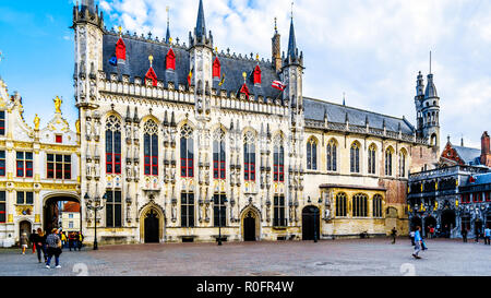 Historic buildings of the Town Hall, and the Basilica of the Holy Blood on the Burg Square in the heart of the medieval city of Bruges, Belgium Stock Photo