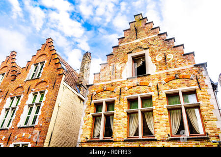 Historic houses with step gables in the historic center of the famous  medieval city of Bruges, Belgium Stock Photo