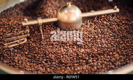 Coffee roaster, freshly roasted coffee beans background Stock Photo