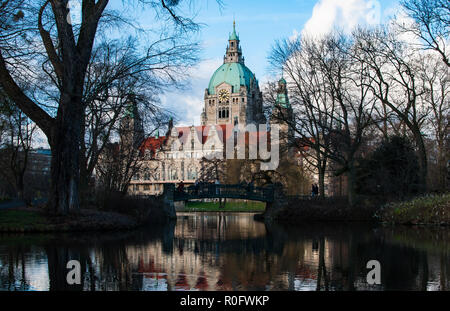 The town hall of hanover and it's garden reflected in the water in Germany Stock Photo