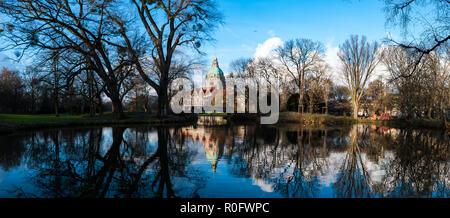 The town hall of hanover and it's garden reflected in the water in Germany Stock Photo
