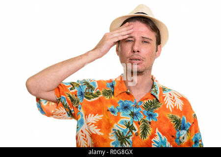 Handsome Caucasian man having headache ready for vacation Stock Photo