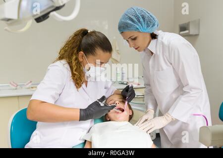 Dentist makes anesthetic injection in the gum. Stock Photo