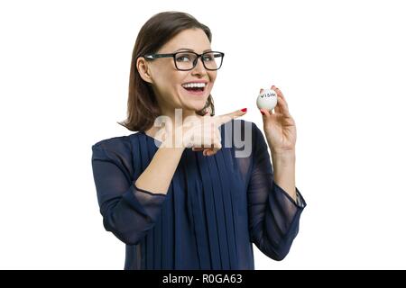 Businesswoman holds an egg in her hands with an abstract vision text, isolated Stock Photo