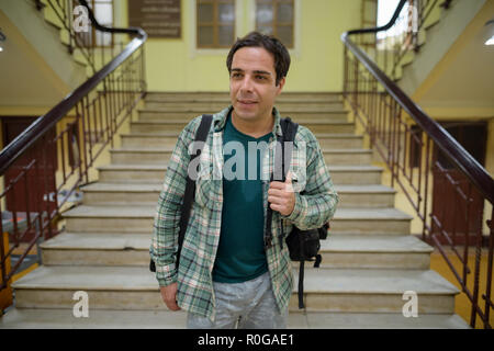 Handsome Persian tourist man at the railway station in Bangkok,  Stock Photo