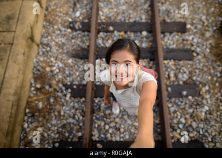 Young beautiful Asian tourist woman at the railway station in Ba Stock Photo