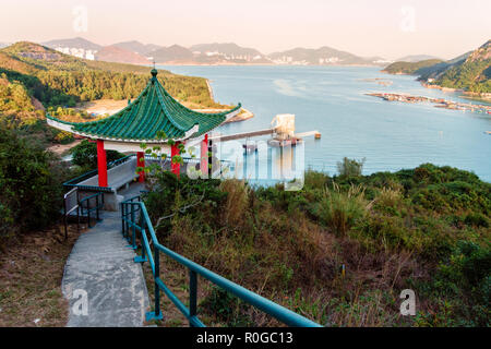 Sok Kwu Wan bay scenery from Family Walk trail on Lamma Island, Hong Kong. Chinese pagoda on observation platform Stock Photo