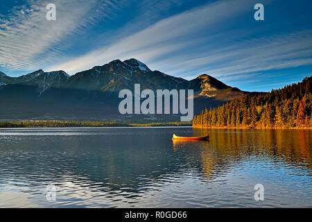 A landscape image of a cedar strip canoe moored on Pyramid Lake in Jasper National Park Alberta Canada. Stock Photo