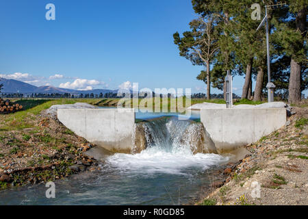 An canal weir on the central plains water irrigation system in Canterbury, New Zealand Stock Photo