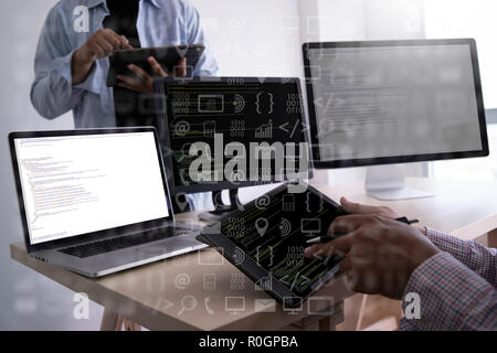 man work Coding software developer programmer is coding on a desktop computer Stock Photo