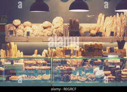Modern bakery with assortment of bread, cakes and buns