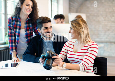 Picture of young attractive designers looking at camera Stock Photo