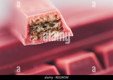 Finger Ruby Chocolate Bar made from ruby cocoa bean. New dimension of chocolate sweets. Stock Photo