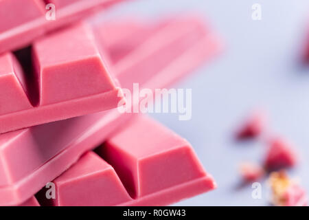 Finger Ruby Chocolate Bar made from ruby cocoa bean. New dimension of chocolate sweets. Stock Photo