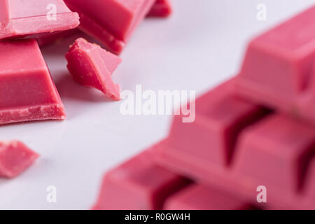 Finger Ruby Chocolate Bar made from ruby cocoa bean. New dimension of chocolate sweets. Stock Photo
