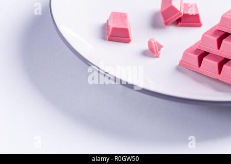 Finger Ruby Chocolate Bar made from ruby cocoa bean. New dimension of chocolate sweets. Stock Photo