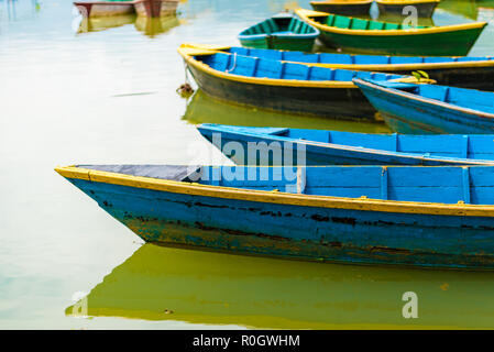 Pokhara, Nepal - July 31, 2018 : Colourful boats on Phewa lake in Pokhara, the most popular and visited lake of Nepal. Stock Photo