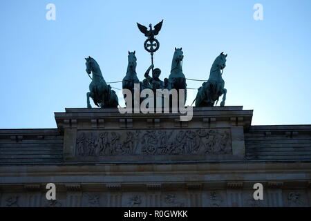 Backlit Quadriga on Brandenburger Tor in Berlin Stock Photo
